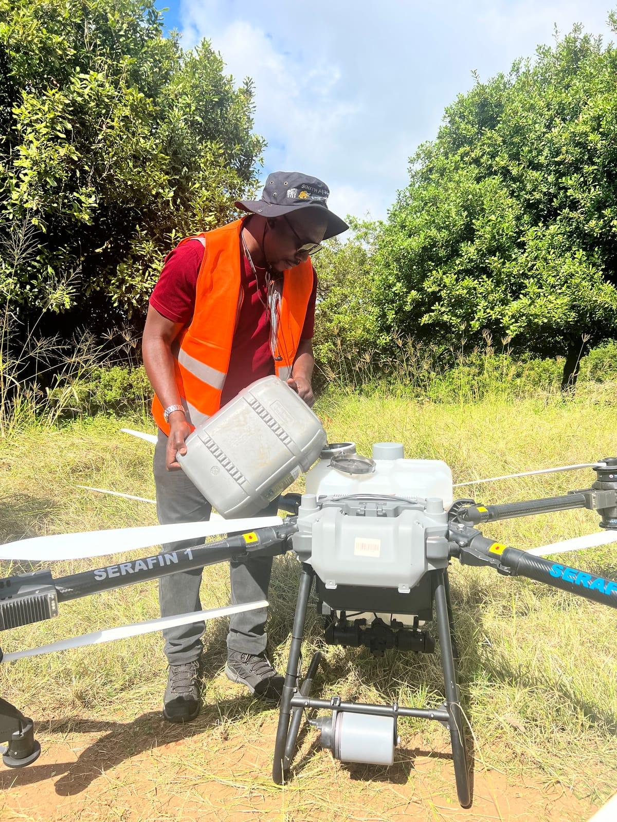 Serafin pilot filling the spray tank of the SERAFIN 1 agricultural drone