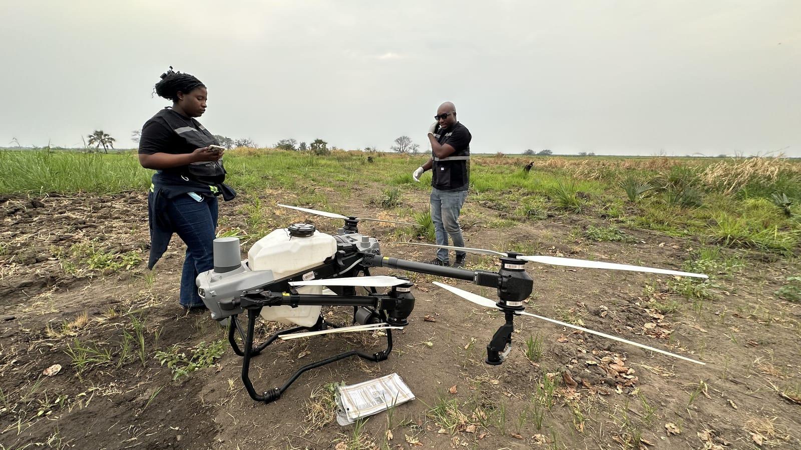 Crew running pre-flight checks on the drone in Salima